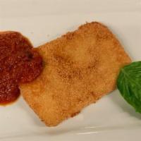 Mozzarella In Carrozza · Mozzarella, coated in our special batter, fried golden brown with house-made marinara sauce.