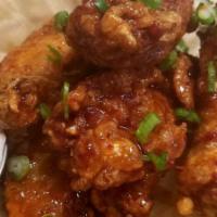 Korean Fried Chicken Wings · Popular item. Six pieces. Soy garlic sauce or spicy sauce.