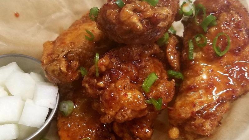 Korean Fried Chicken Wings · Popular item. Six pieces. Soy garlic sauce or spicy sauce.