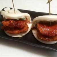 Spicy Chicken Bao · Spicy. Two pieces of bun with fried chicken breast with spicy sauce, mayo, cucumbers, and pi...