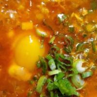 Soon Doo Boo Chigae · Popular item. Spicy. Pork, kimchi, mushroom or seafood. Spicy soft tofu stew with onion, gre...