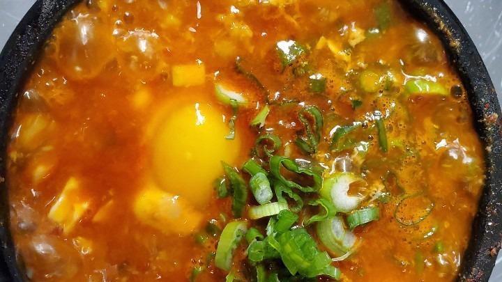 Soon Doo Boo Chigae · Popular item. Spicy. Pork, kimchi, mushroom or seafood. Spicy soft tofu stew with onion, green squash and egg served with egg.