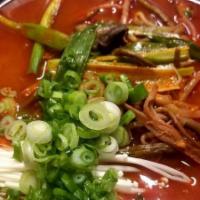 Yukaejang With Ramen · Spicy beef soup made from shredded beef with scallions, bean sprout, bracken and mushroom.