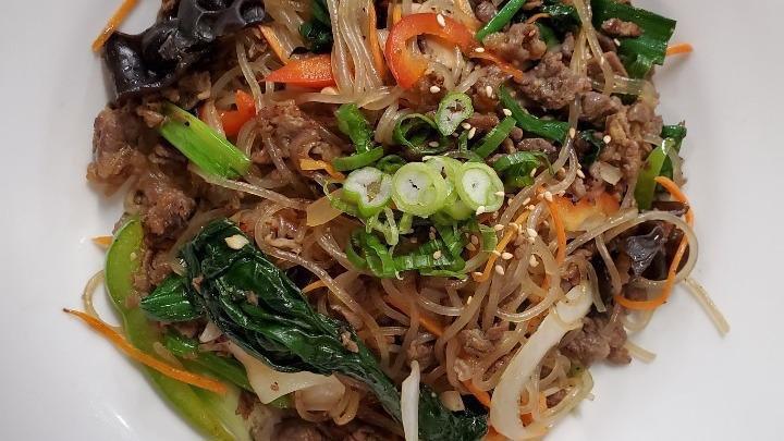 Japche · Veggie only, beef and veggie or tofu. Sweet potato clear noodles, scallion, peppers, onion, spinach, mushrooms and carrots.
