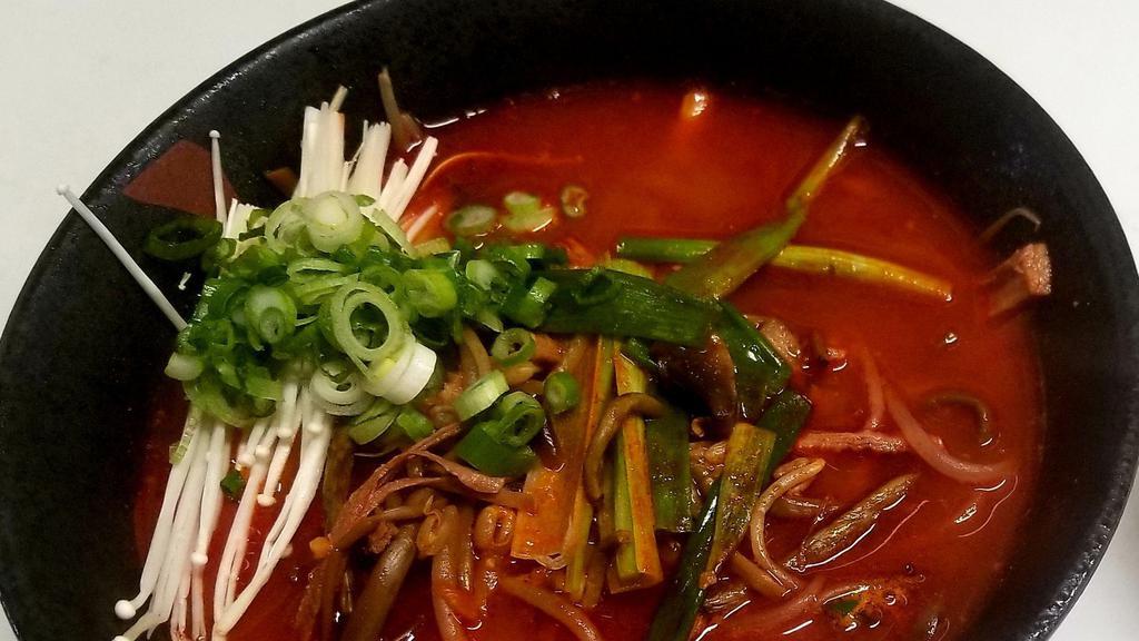 Yukaejang · Spicy beef soup made from shredded beef with scallions, bean sprout, bracken and mushroom.