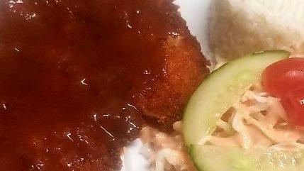 Chicken Katsu · Breaded chicken, homemade donkatsu sauce, rice and salad with Russian dressing.