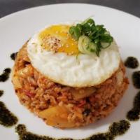 Kimchi Fried Rice Lunch Special · Pork or veggie. Rice, onion, scallion, peppers, kimchi, sunny side egg and sesame seeds. Spi...
