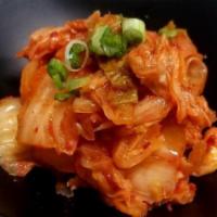 Kimchi · Fermented spicy Napa cabbage.