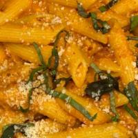 Penne Vodka · Penne pasta smothered in our homemade vodka sauce topped with fresh Romano, Parmesan, and to...