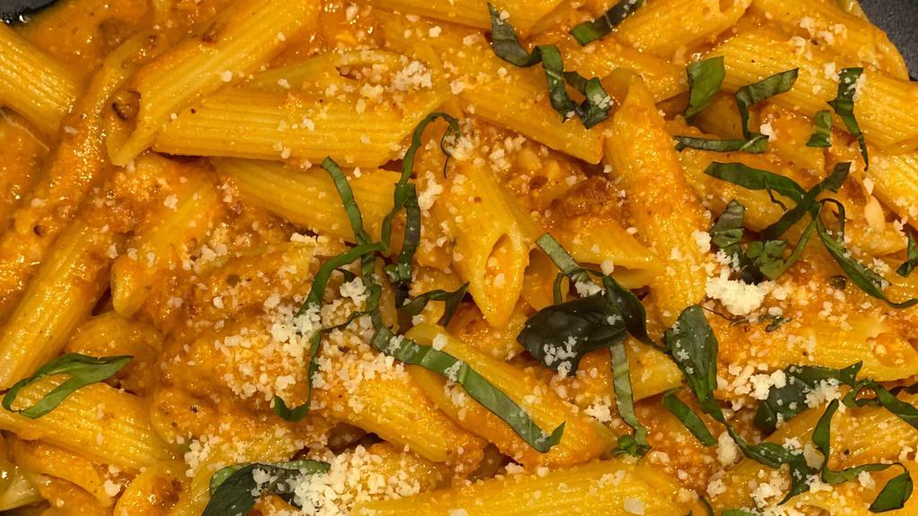 Penne Vodka · Penne pasta smothered in our homemade vodka sauce topped with fresh Romano, Parmesan, and topped with basil.