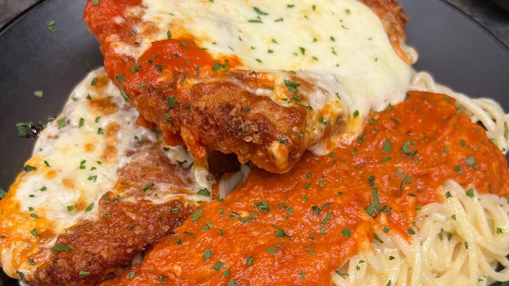 Chicken Parm · Penne pasta smothered in our homemade vodka sauce topped with fresh Parmesan cheese and basil.