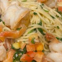 Shrimp Scampi · A seasoned white wine butter sauce, served with wilted spinach, diced tomato, with linguine ...