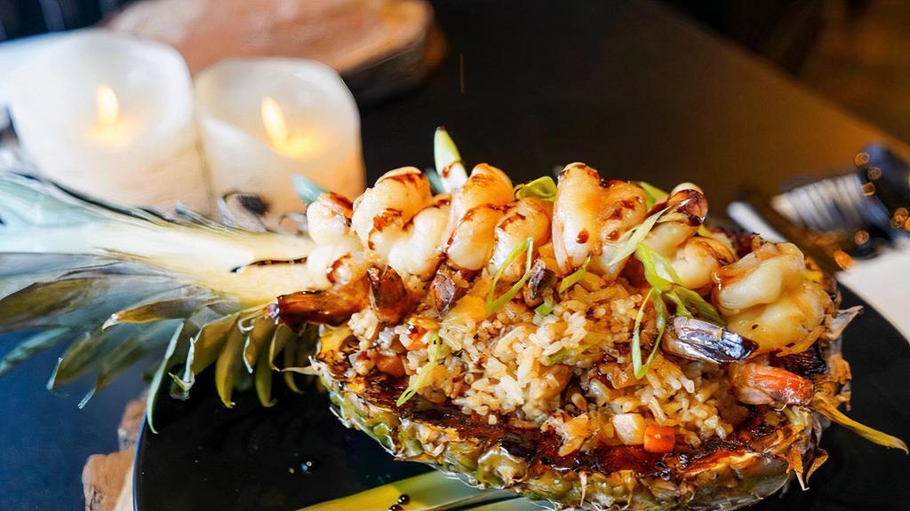 Pineapple Bowl · Your choice of grilled chicken or shrimp with fresh pineapple mixed in a sweet teriyaki sauce served on a bed of white rice inside of a pineapple.