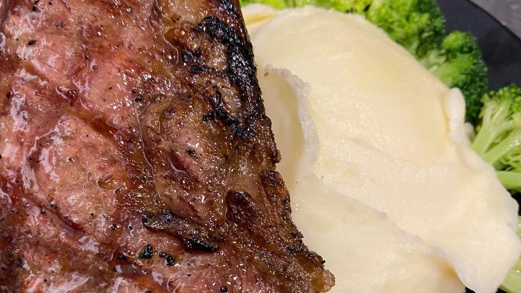 Dry Aged Ny Strip · Herb-rubbed, served with mashed potatoes and a side of your choosing.