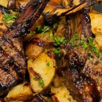 Lamb Rack Chops · Lamb chops with a balsamic glaze served with roasted potatoes.