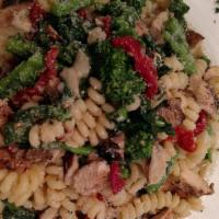 Fusilli Fantasia · Grilled chicken, broccoli rabe and sun-dried tomatoes sautéed in a garlic and olive oil brod...