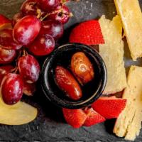 Flute'S Cheese & Fruit Plate · Gruyere, Manchego and Brie Cheeses served with fresh fruits, walnuts and dried dates on the ...
