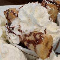 Banana Boom · Battered Fried Banana, Served With 2 Scoops Of Ice Cream & Whipped Cream.