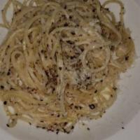 Spaghetti Cacio E Pepe · with  cracked black pepper and melted pecorino romano cheese.
