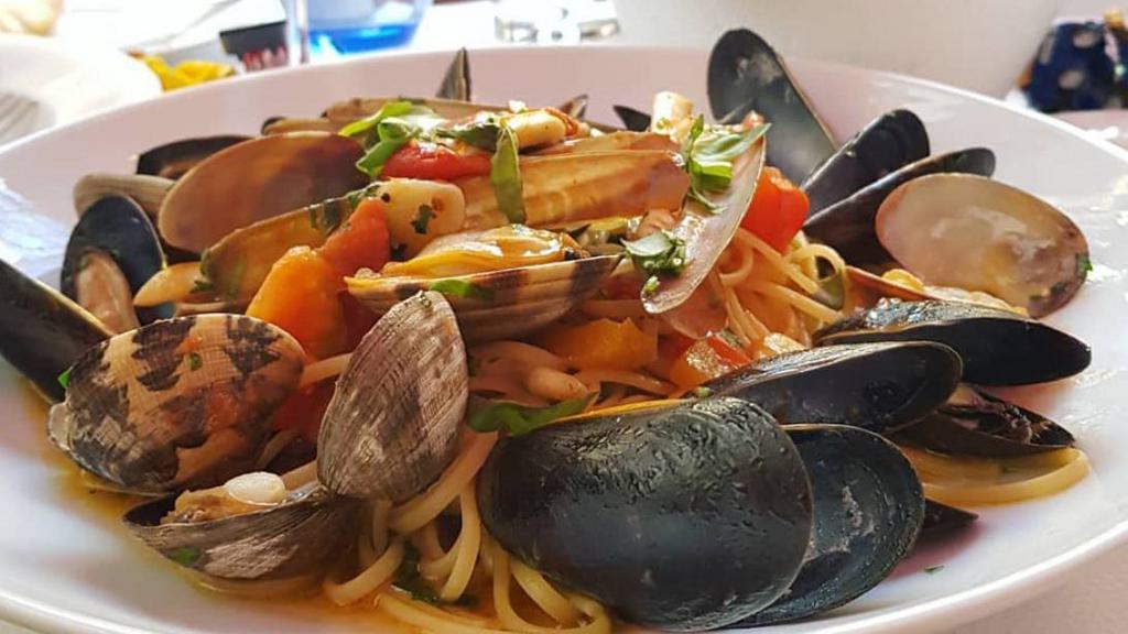 Mezzi Paccheri Frutti Di Mare · scallops, shrimps, mussels, calamari and clams in a spicy tomato sauce