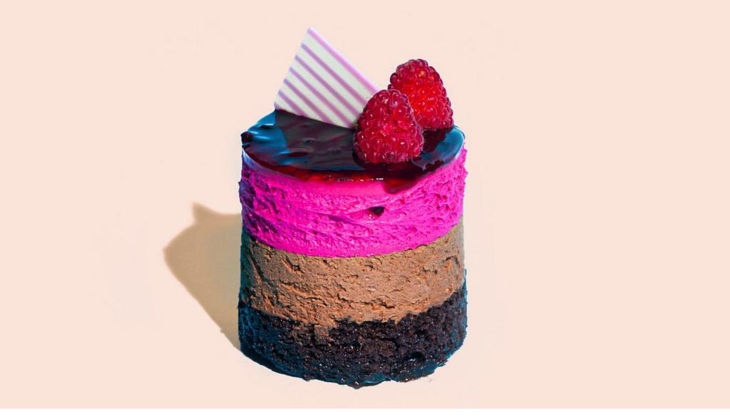 Raspberry Mousse · Raspberry Mousse Cake is a double layer mousse cake. The dark chocolate mousse on the bottom is rich with an intense chocolate flavor using melted chocolate and Dutch cocoa powder. It’s topped with a delicate raspberry mousse filled with fresh raspberries.
