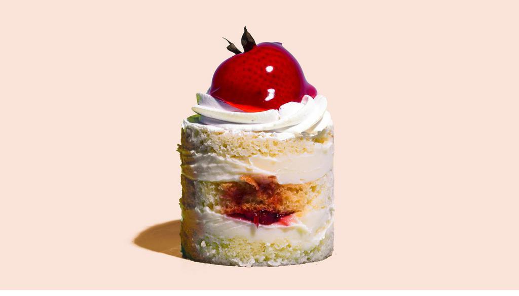 Strawberry Shortcake · Delicious layers of dense, buttery and moist vanilla short cake filled with fresh whipped vanilla custard, whipped cream & a luscious fresh strawberry filling.