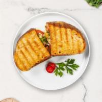 Made In Monte Cristo Panini · Turkey ham, smoked turkey, swiss cheese, lettuce, tomato, honey mustard on panini bread.