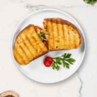 Chuck Cluck Club Panini · Grilled chicken, bacon, brie cheese, plum tomato, choice of dressing.