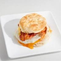 Biscuit Breakfast Sandwich · A flaky hot biscuit sandwich served with egg, Cheddar cheese, and your choice of bacon, ham,...