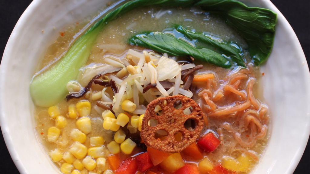 Vegan Miso Ramen · Vegan. Umami rich miso, mushroom broth, and wavy flour noodles, topped with a colorful array of thinly sliced red and yellow bell peppers, sweet com, bok choy, tofu, and bean sprouts.