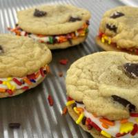 Chocolate Chip Cookie Sandwich · Chocolate chip cookies with vanilla frosting and rainbow sprinkles.