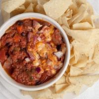 Harbor Q'S Famous Chili · Blend of beef and pork topped with diced red onions, melted cheddar and served with tortilla...