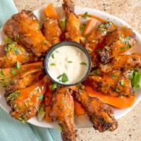 Jumbo Buffalo Wings · Traditional deep fried wings served with carrots, celery and blue cheese dressing.