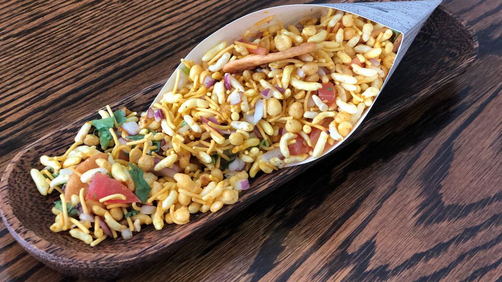 Chowpatty Ki Bhel · Vegan. A classic of the Mumbai street carts- puffed rice mixed with, onions, tomatoes, cilantro, mint, mongo - oh boy it's bursting with flavors.