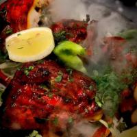 Tandoori Chicken · A secret family recipe smoked in the tandoori.