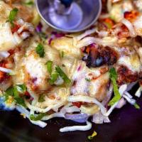 Akbari Kebab ( New Item ) · saffron infused boneless chicken, minced lamb, cheese, garlic malai drizzle
