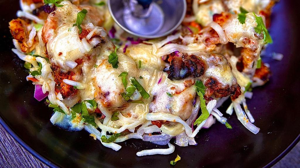 Akbari Kebab ( New Item ) · saffron infused boneless chicken, minced lamb, cheese, garlic malai drizzle