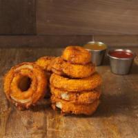 Onion Rings · Homemade onion rings battered with a subtle blend of spices and fried to crispy, golden, del...