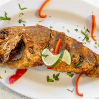 Pescado Entero (Red Snapper) Chorrillna Con Arroz · Whole Fried Fish (Red Snapper) with sauteed onions served with steamed white rice and steam ...