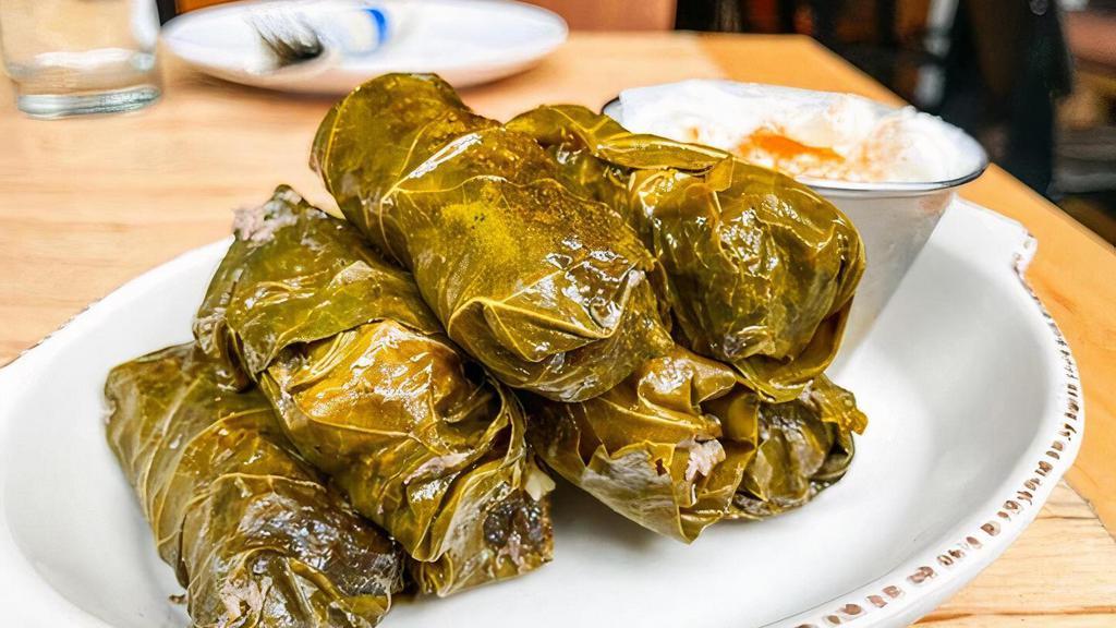 Meat Dolmades (Stuffed Grape Leaves) · Grape leaves stuffed w/ rice, vegetables and ground beef. Served warm.