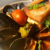 Greek Mussels · mussels steamed w/ garlic, tsipouro, marinara, feta cheese, pita chips
