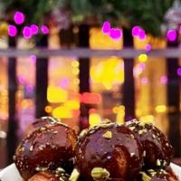 Nutella Pistachio Loukoumades V · Baby donuts w/ Nutella and toasted pistachios