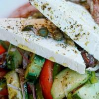 Horiatiki (Greek Village Salad) · kumato tomatoes, cucumbers, peppers, red onions, olives,
oregano, feta, vinaigrette V GF