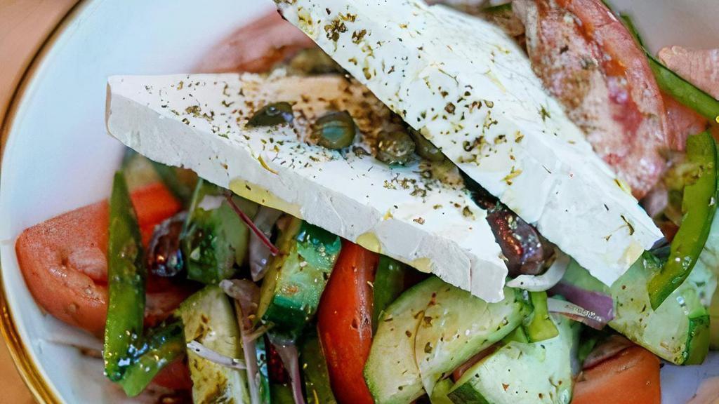 Horiatiki (Greek Village Salad) · kumato tomatoes, cucumbers, peppers, red onions, olives,
oregano, feta, vinaigrette V GF