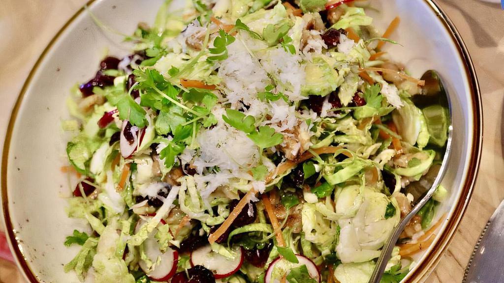 Brussel Sprout Salad · shaved brussel sprouts, radish, carrots, celery, graviera cheese,
walnuts, dried cranberries, honey cider dressing V GF N