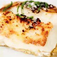 Anginares Mousaka · fresh artichoke heart moussaka, layered with caramelized onions, herbs and three Greek chees...