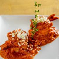 Garides Ouzo · Large shrimp cooked in a light ouzo and tomato cream sauce.