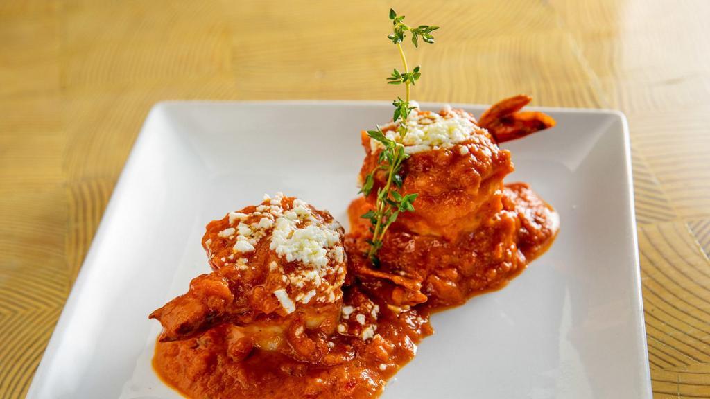 Garides Ouzo · Large shrimp cooked in a light ouzo and tomato cream sauce.