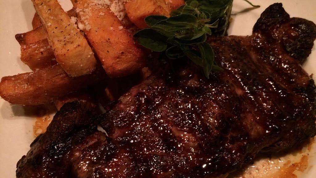 Brizola · 16 ounces aged prime loin steak served with Greek Yiayia’s fried potatoes, and sautéed spinach.