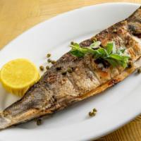 Psari Sta Karvouna · Classic grilled whole fresh fish, dressed with extra-virgin olive oil, and fresh lemon juice.